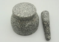 Mortero y maja de piedra natural, mortero del granito de la hierba y maja sólidos
